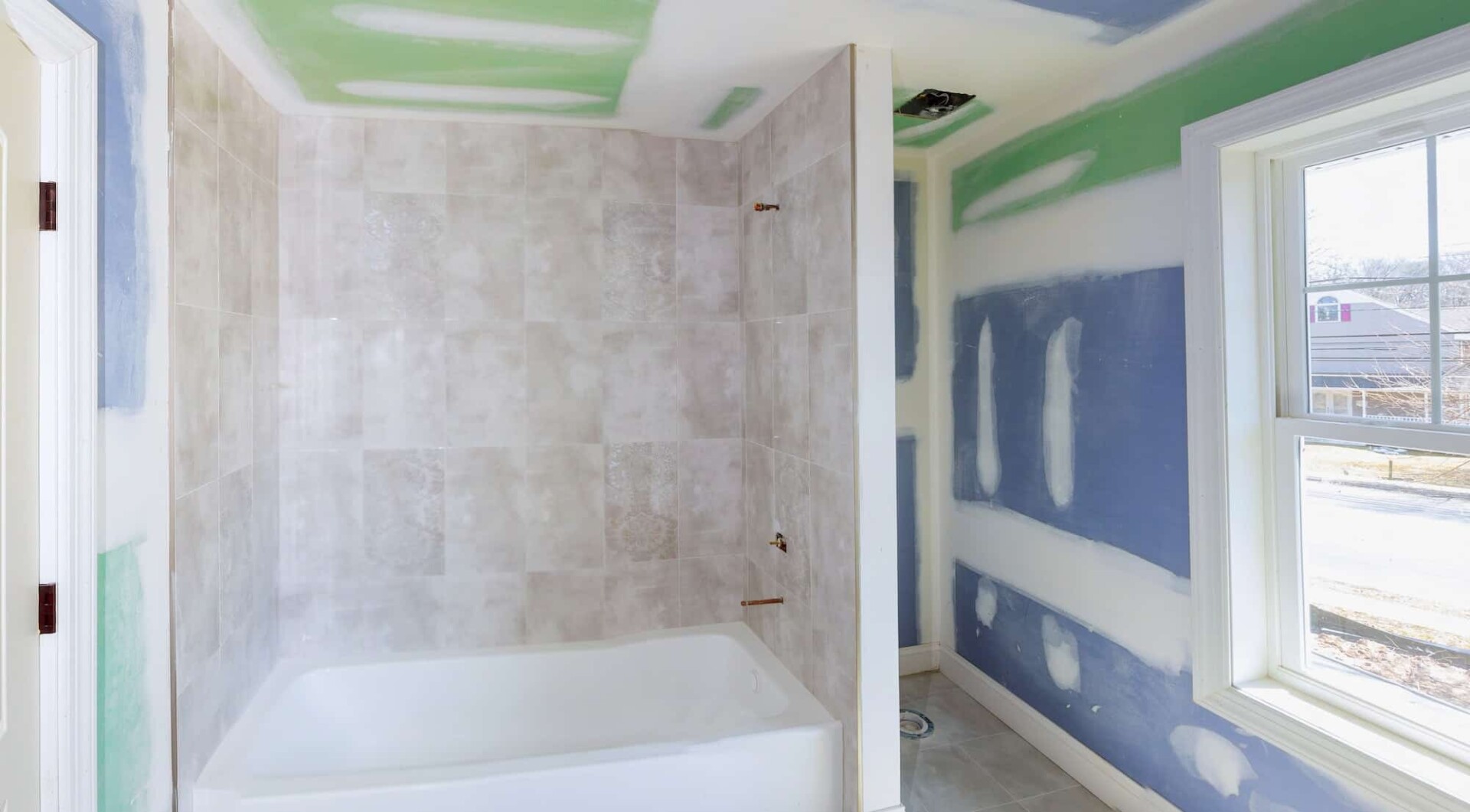 bathroom remodel progresses as drywall is smoothed 1