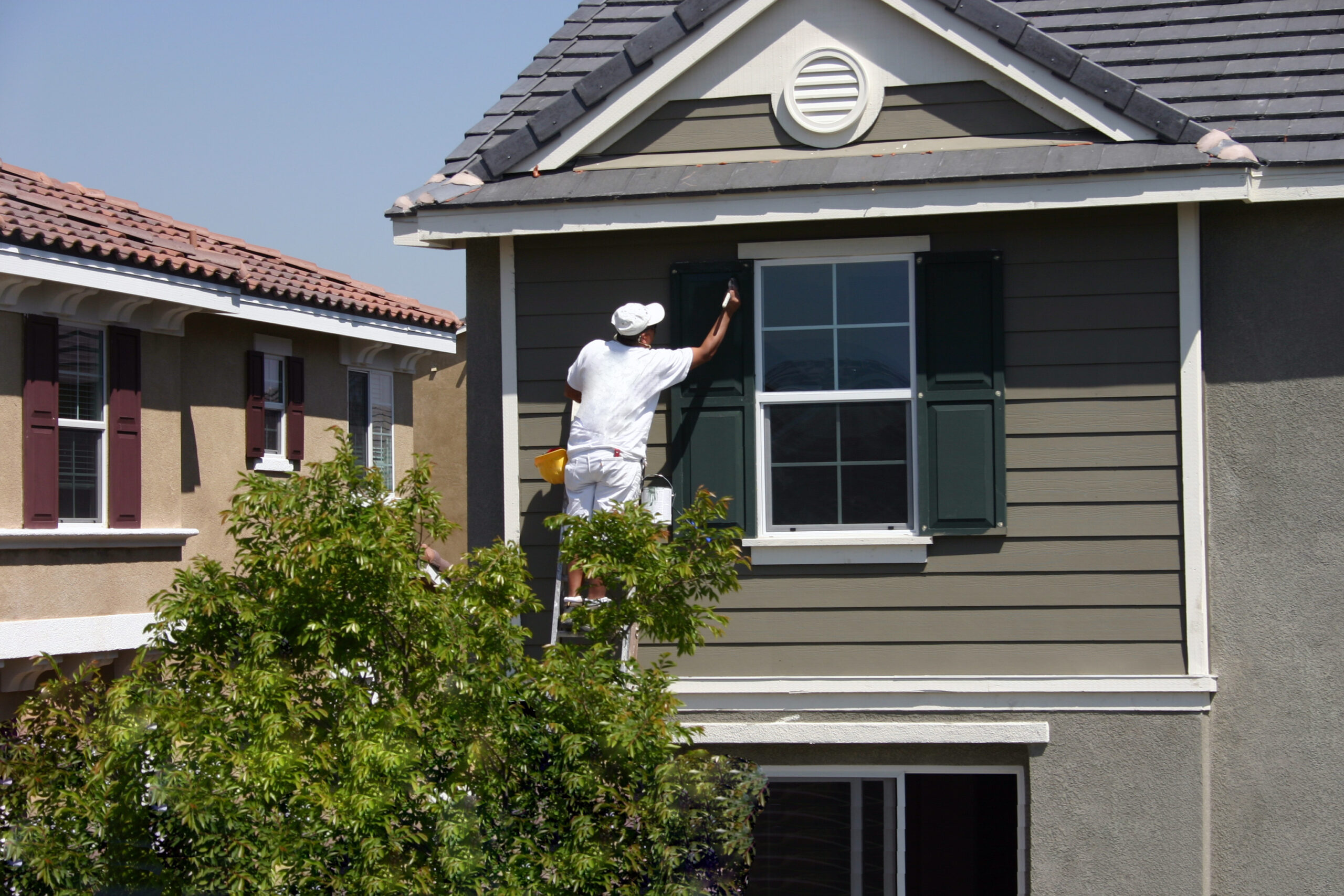 a man painting commercial housing