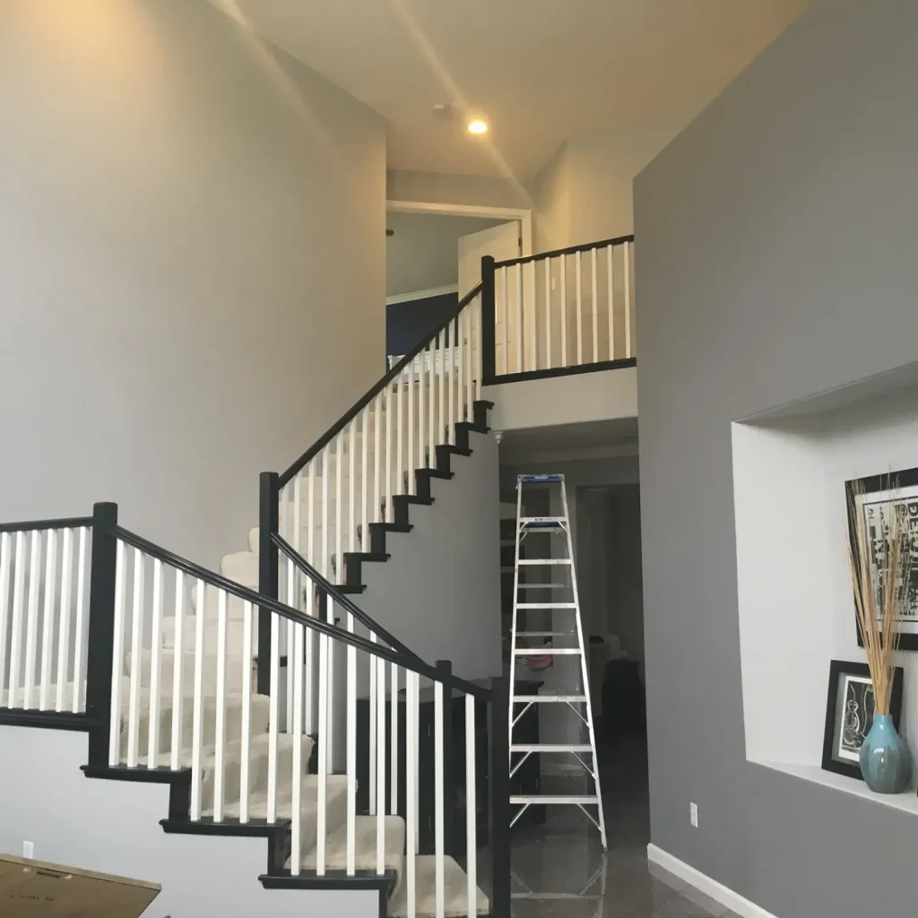 Modern home interior with staircase and decorative elements.