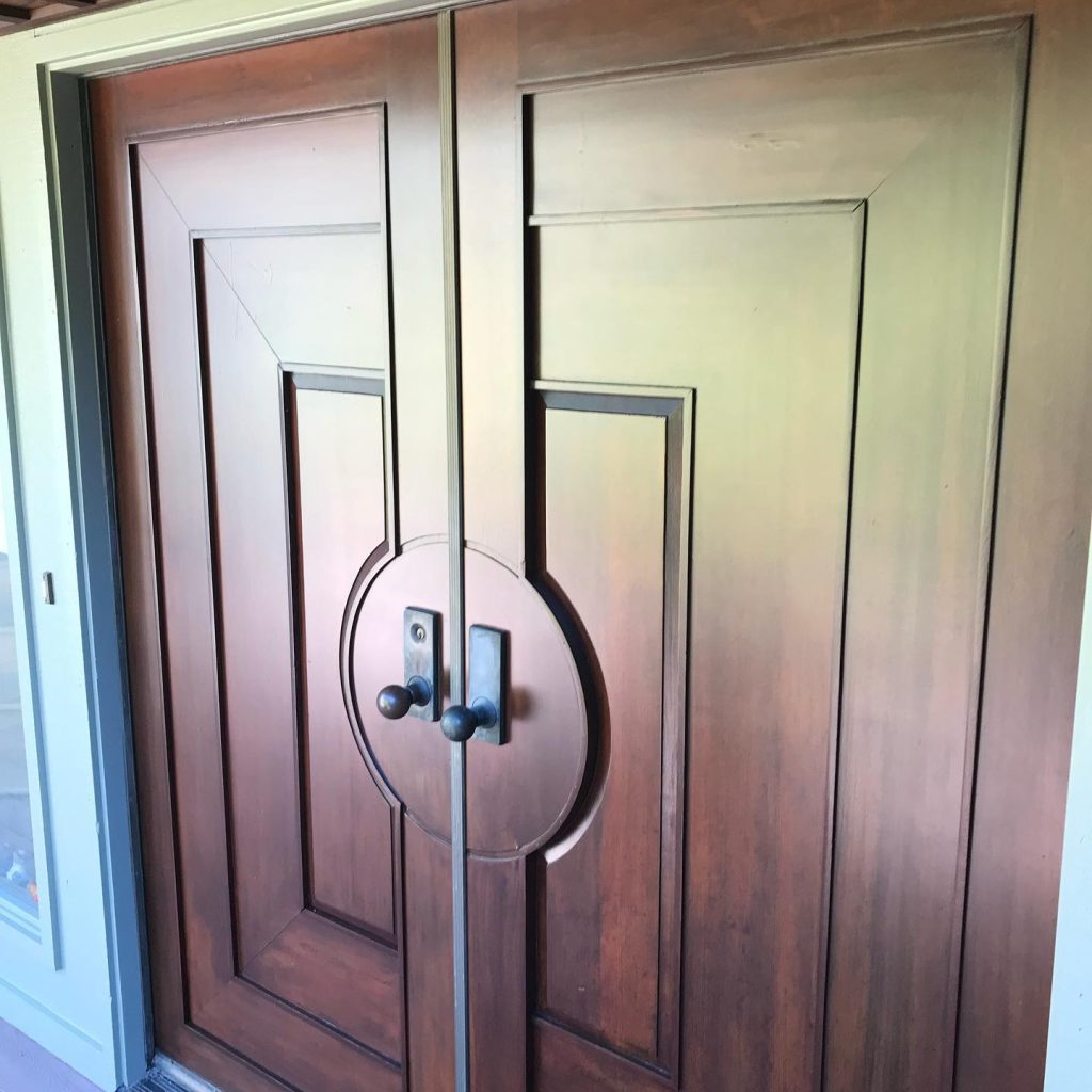 Wooden double entry doors with round handles